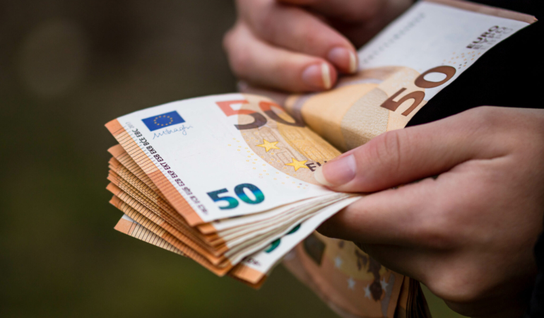 closeup-female-hands-counting-euro-banknotes-world-money-inflation-economy-concept-1-2048x1365
